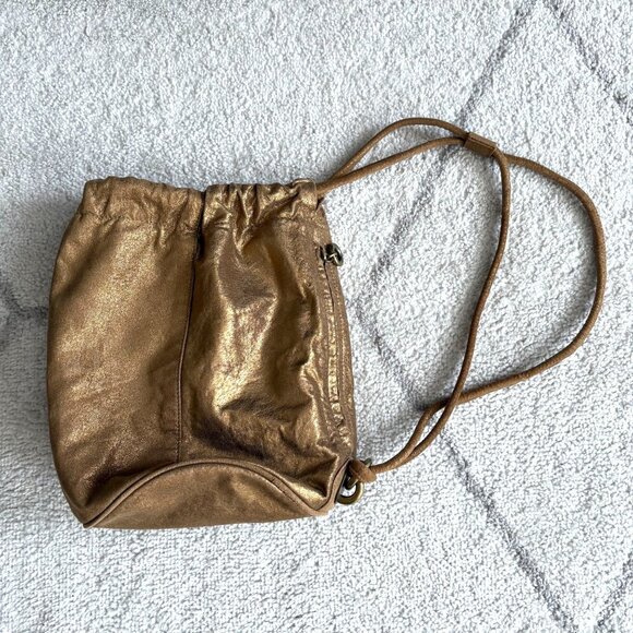 Vintage DKNY Metallic Gold Leather Backpack Purse Drawstring Shoulder Bag - Picture 1 of 7